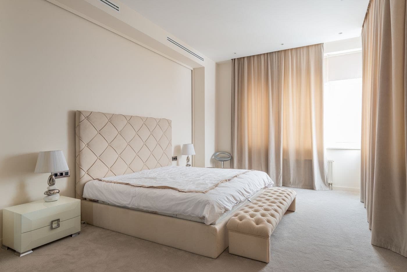 A finished bedroom dressed in soft home textiles