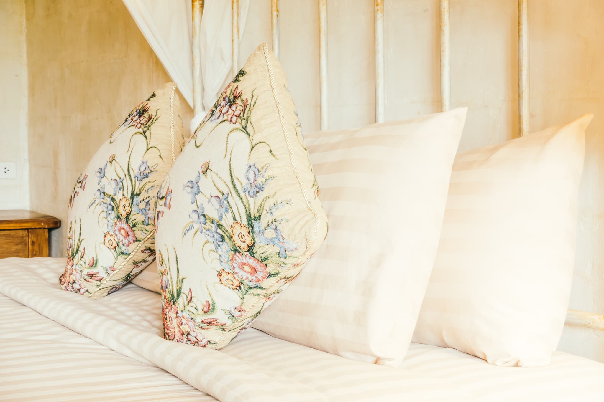 A made-up bed with crisp bedding