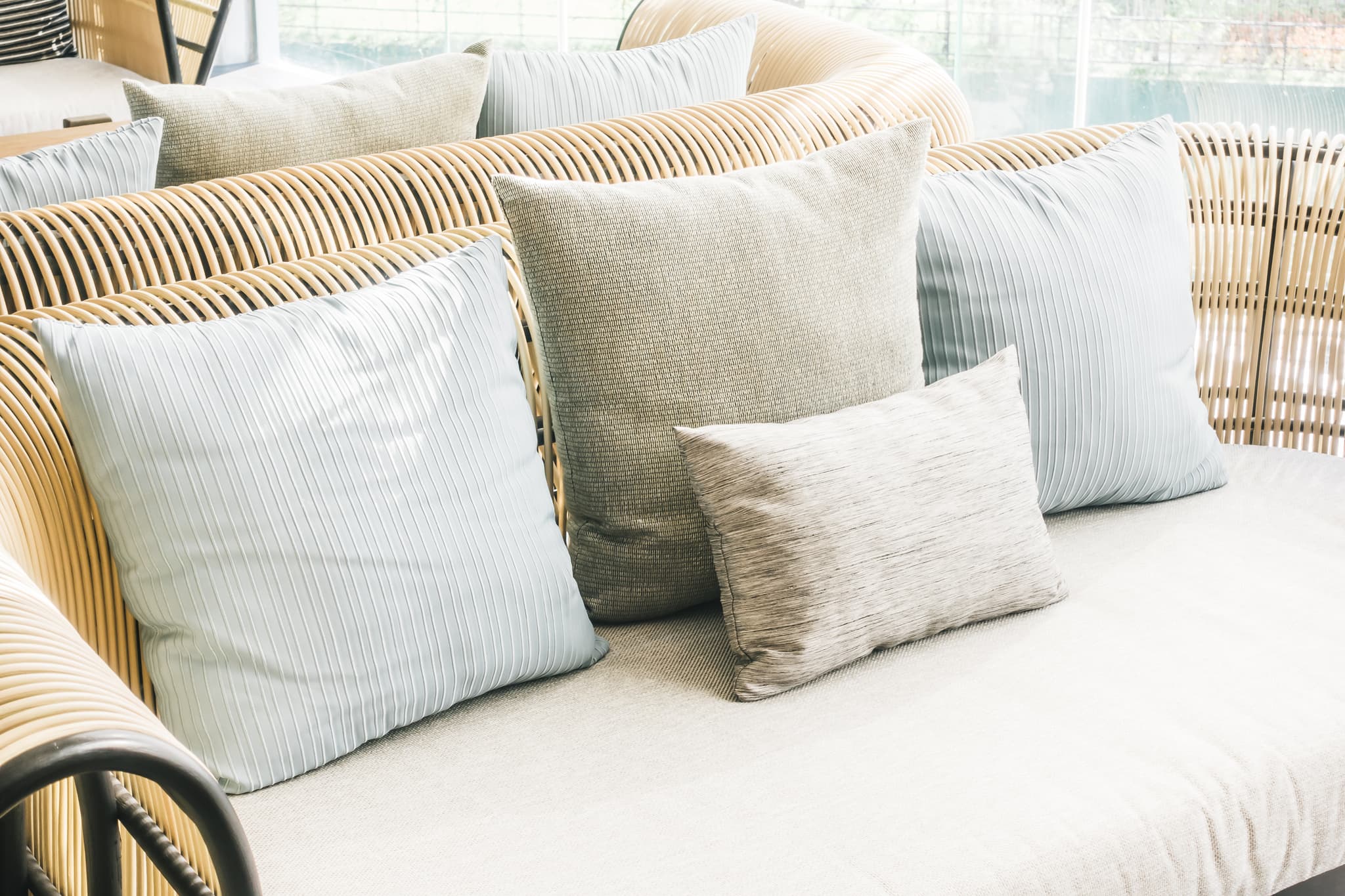 Neutral cushions and a knitted throw