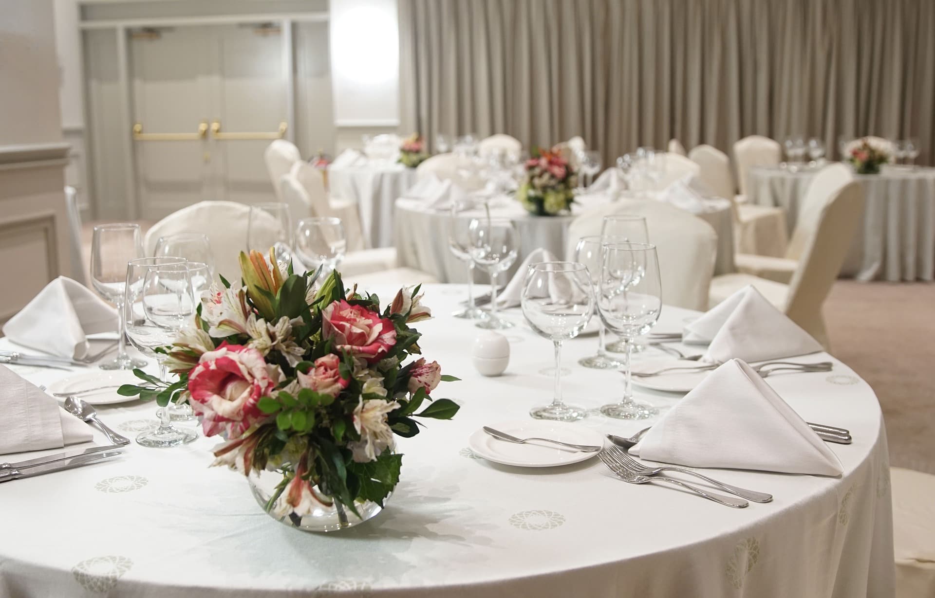 A neutral place setting with table linen and cutlery