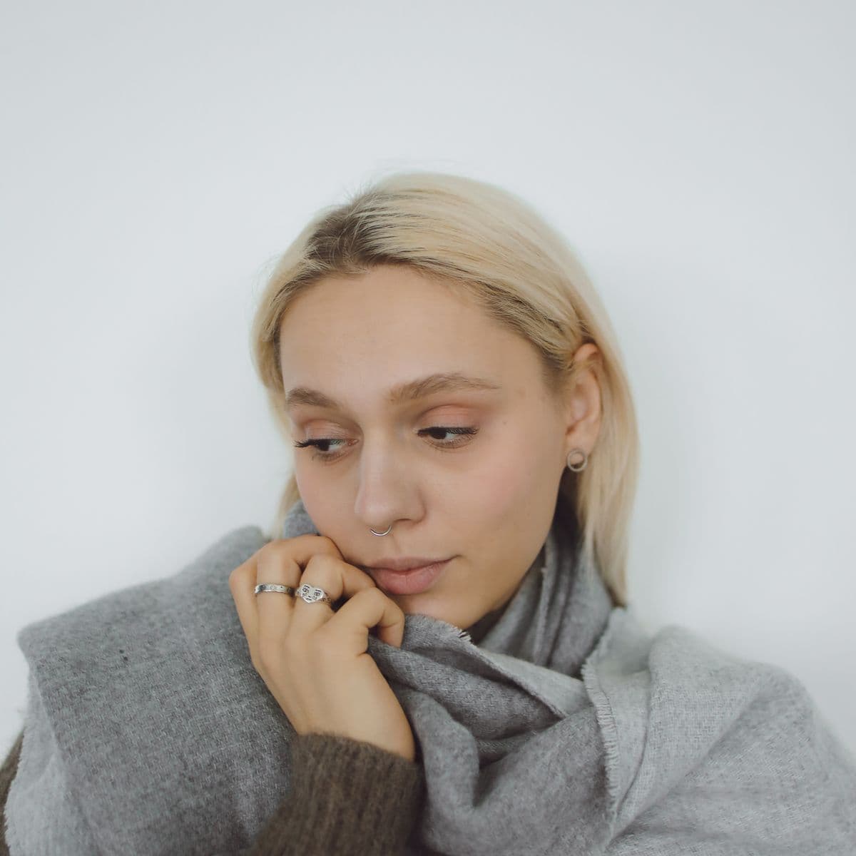 Model in a light grey wrap scarf