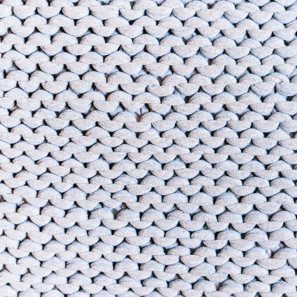 Soft grey chunky garter-stitch knit texture