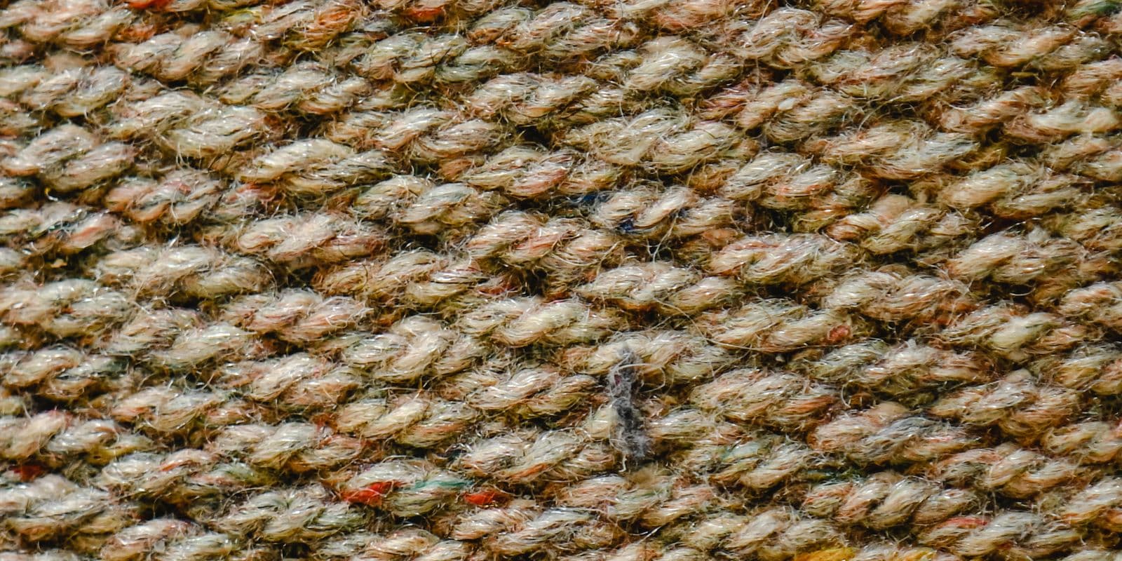 Oatmeal woven wool texture in close detail