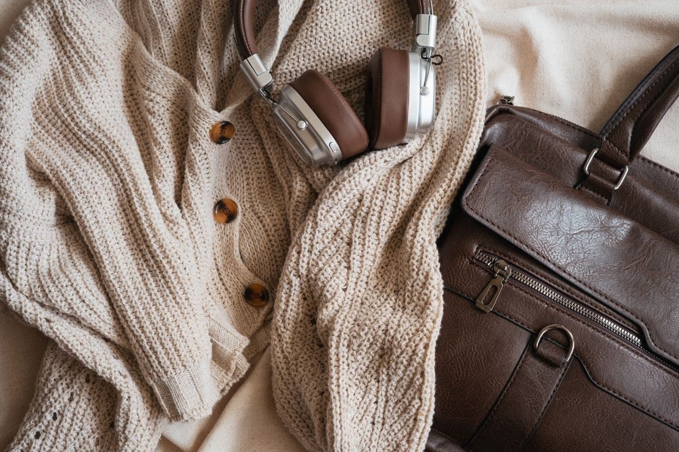 A cozy flat lay of a soft knit and accessories