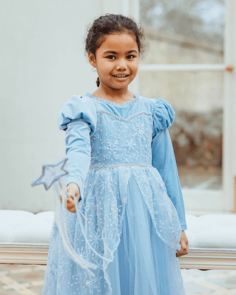 A girl in a flowing party dress