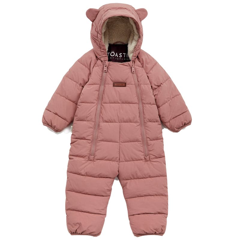 A dusky pink quilted baby onesie