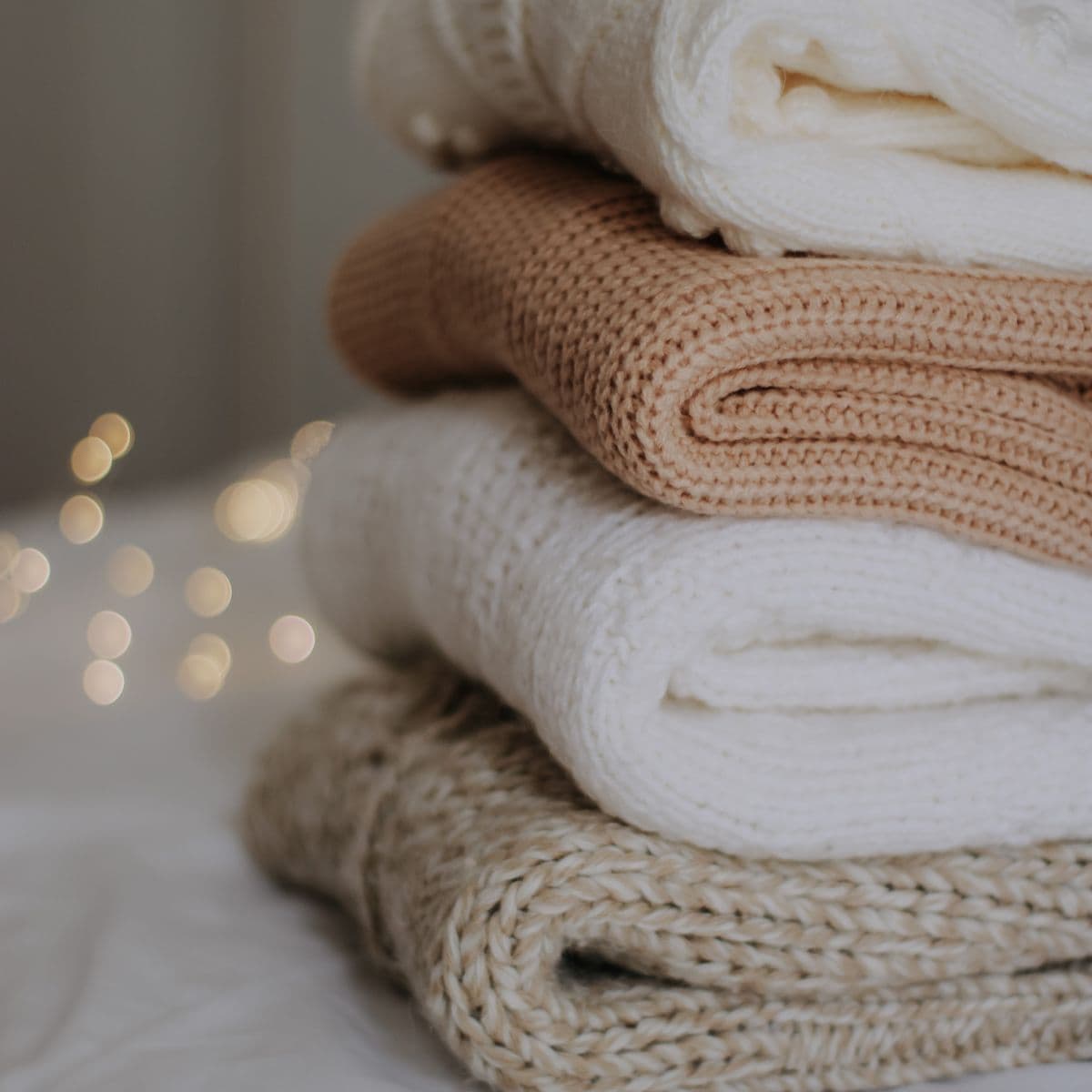 Folded cream and camel baby knits