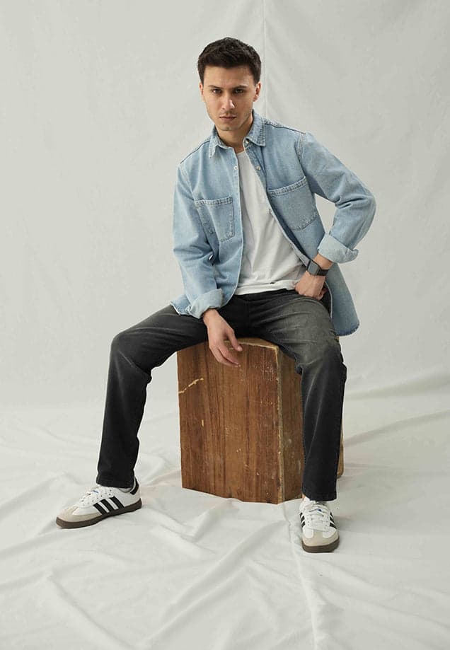 Male model in a faded light-blue denim shirt