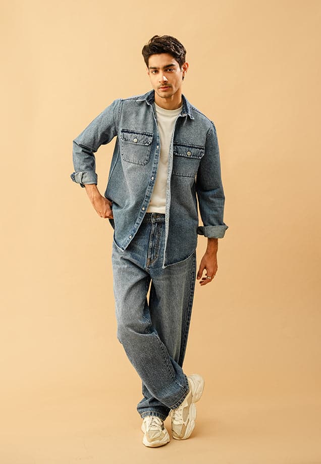 Male model in a mid-blue button-down denim over shirt