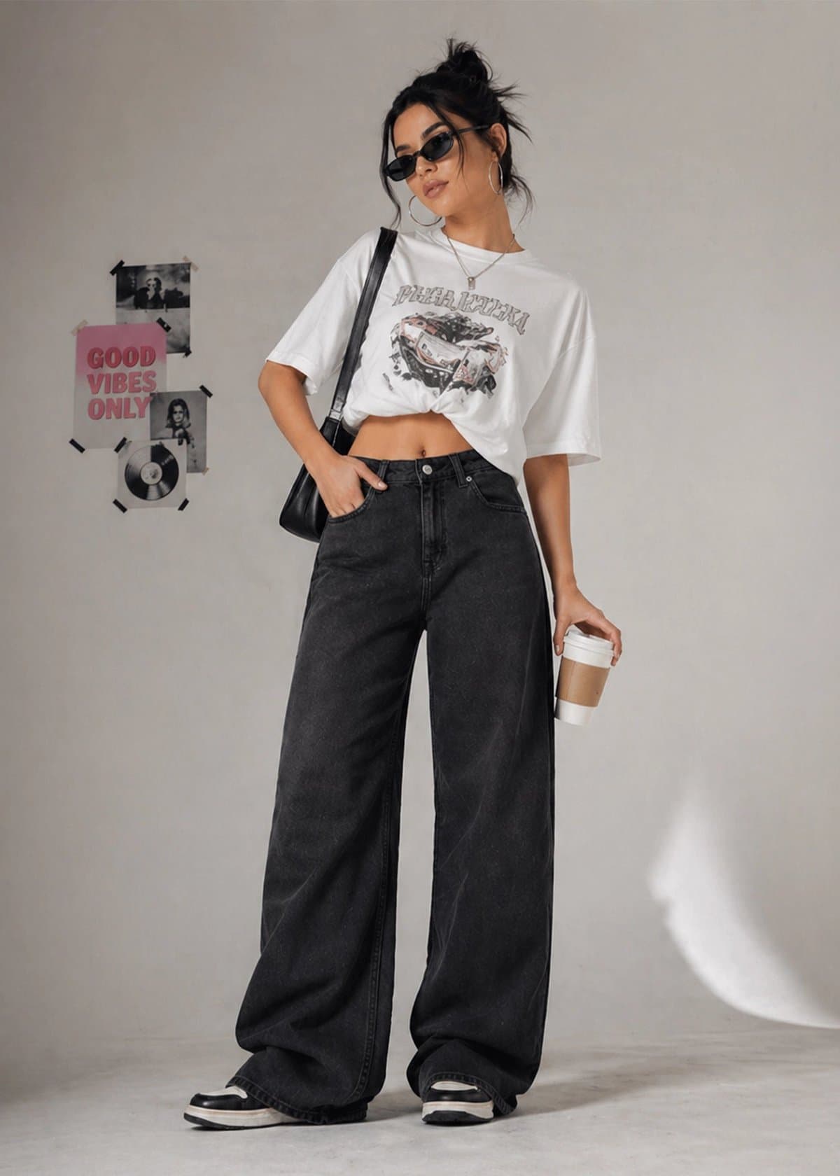 Female model in black wide-leg jeans