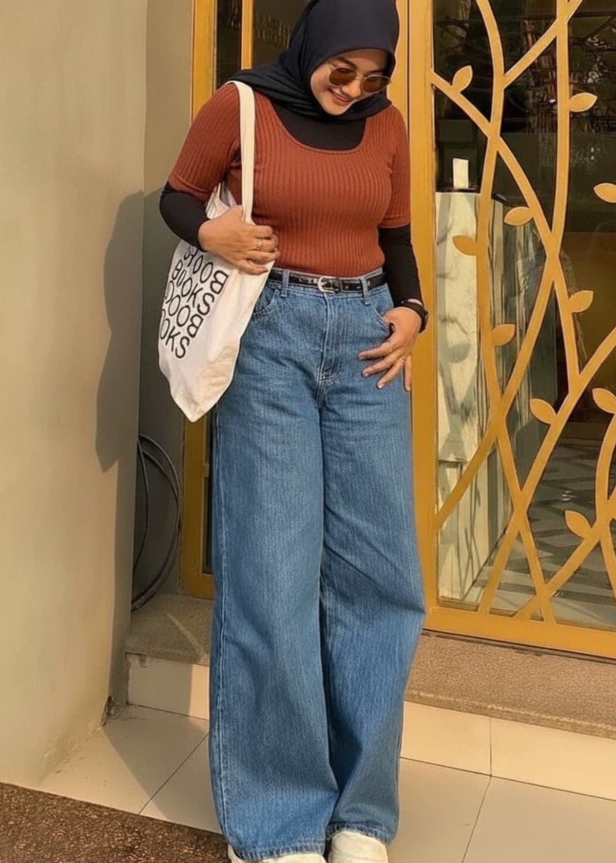 Female model in light-blue wide-leg jeans