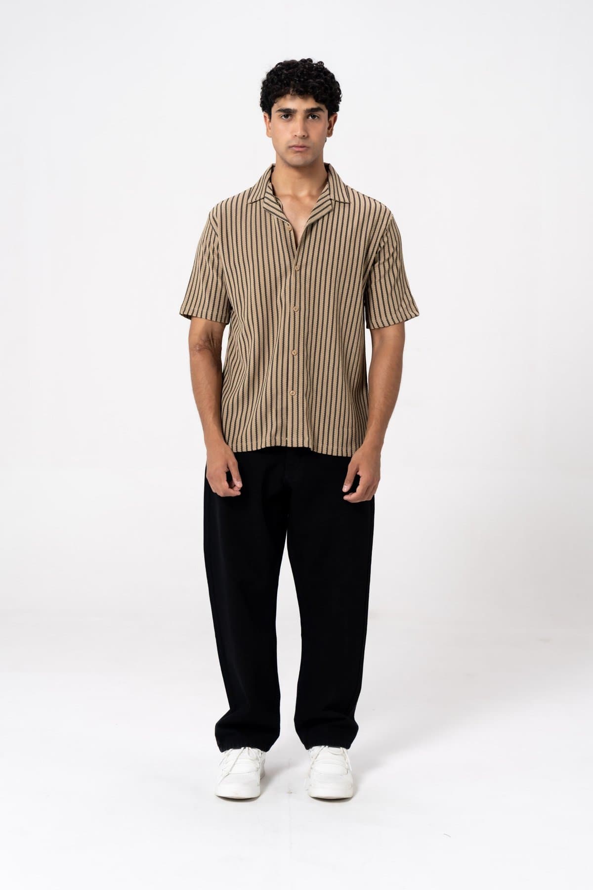 Male model in a black and brown striped woven shirt