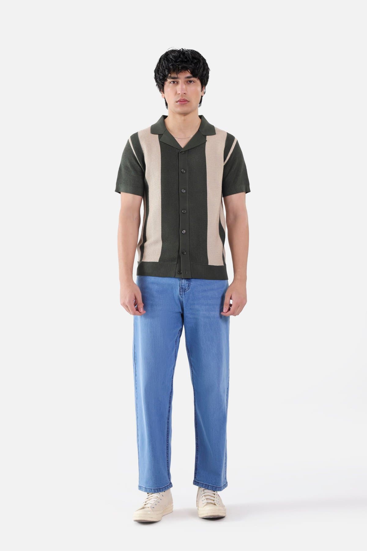 Male model in a green and cream colourblock woven shirt