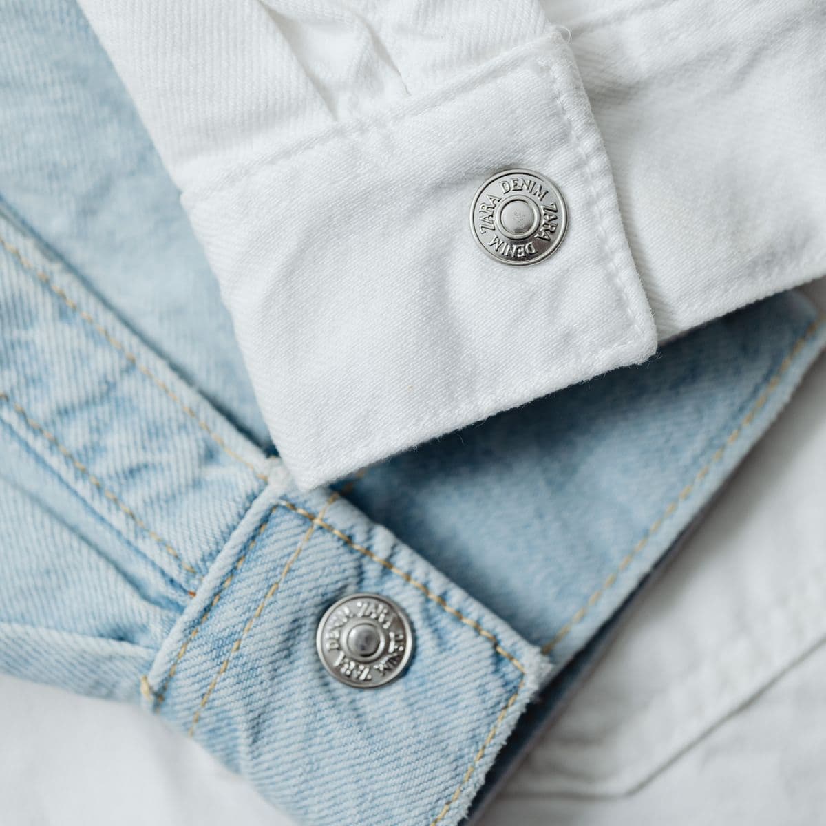 Folded denim jackets with metal buttons