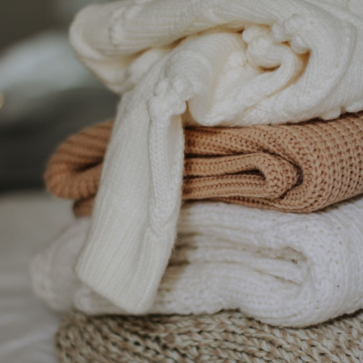 Folded cream and camel knitwear