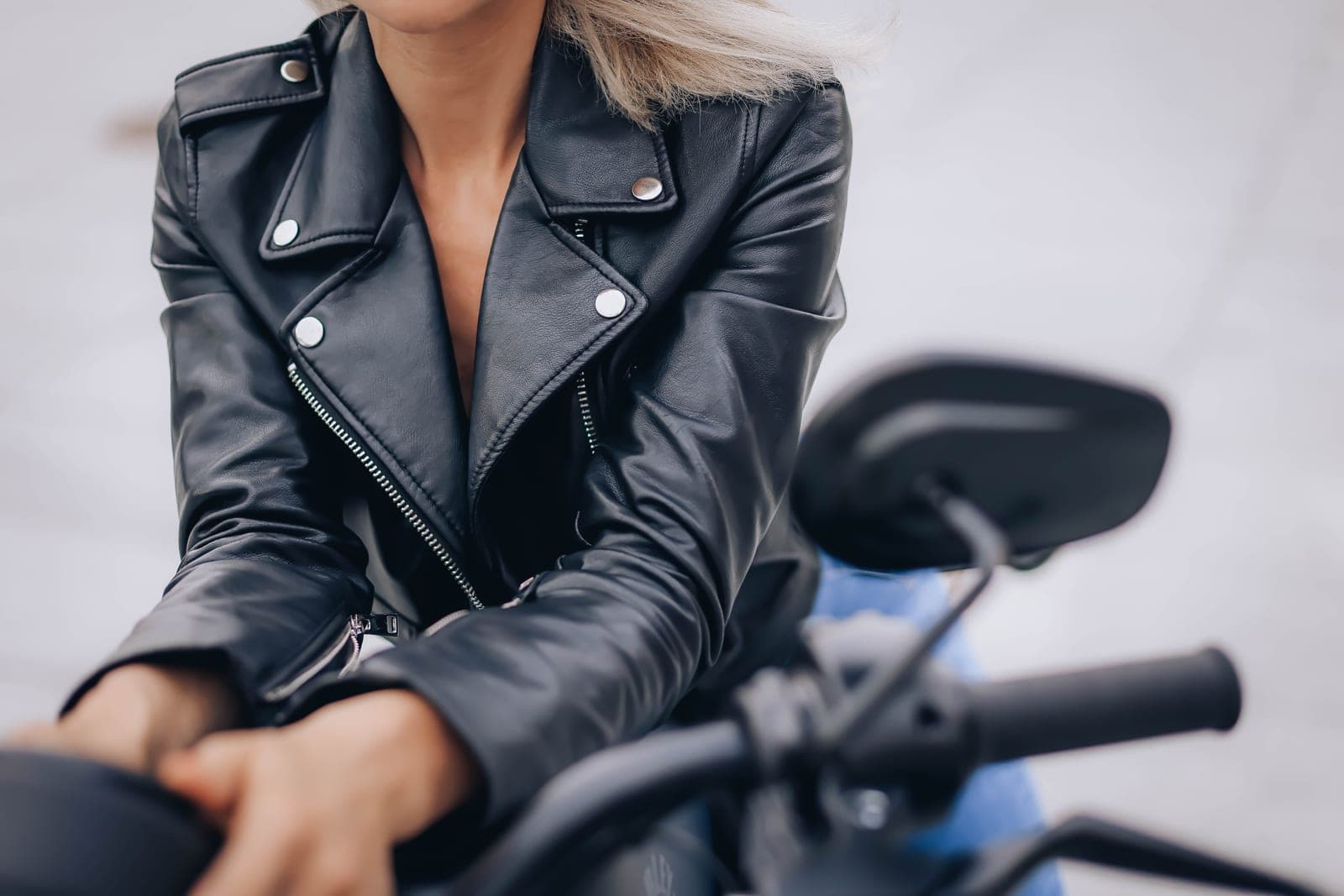 A woman in a black leather jacket