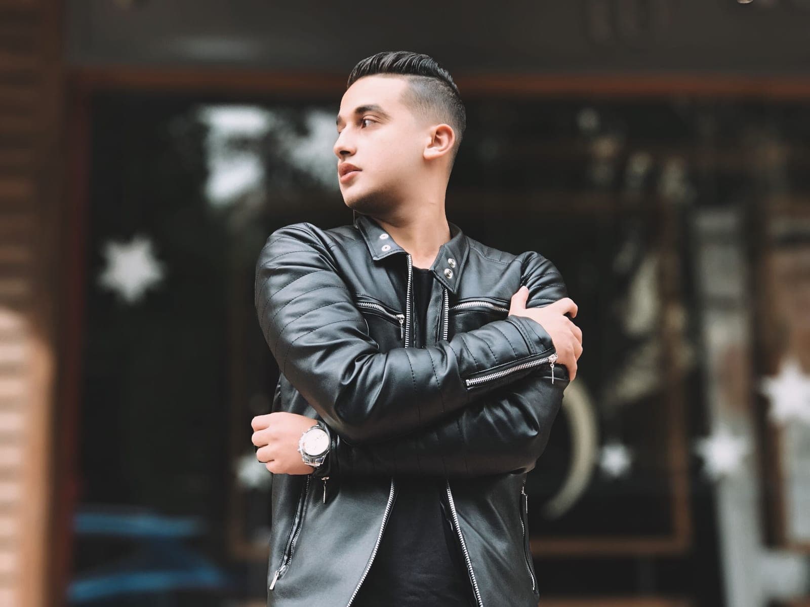 A man in a black leather jacket