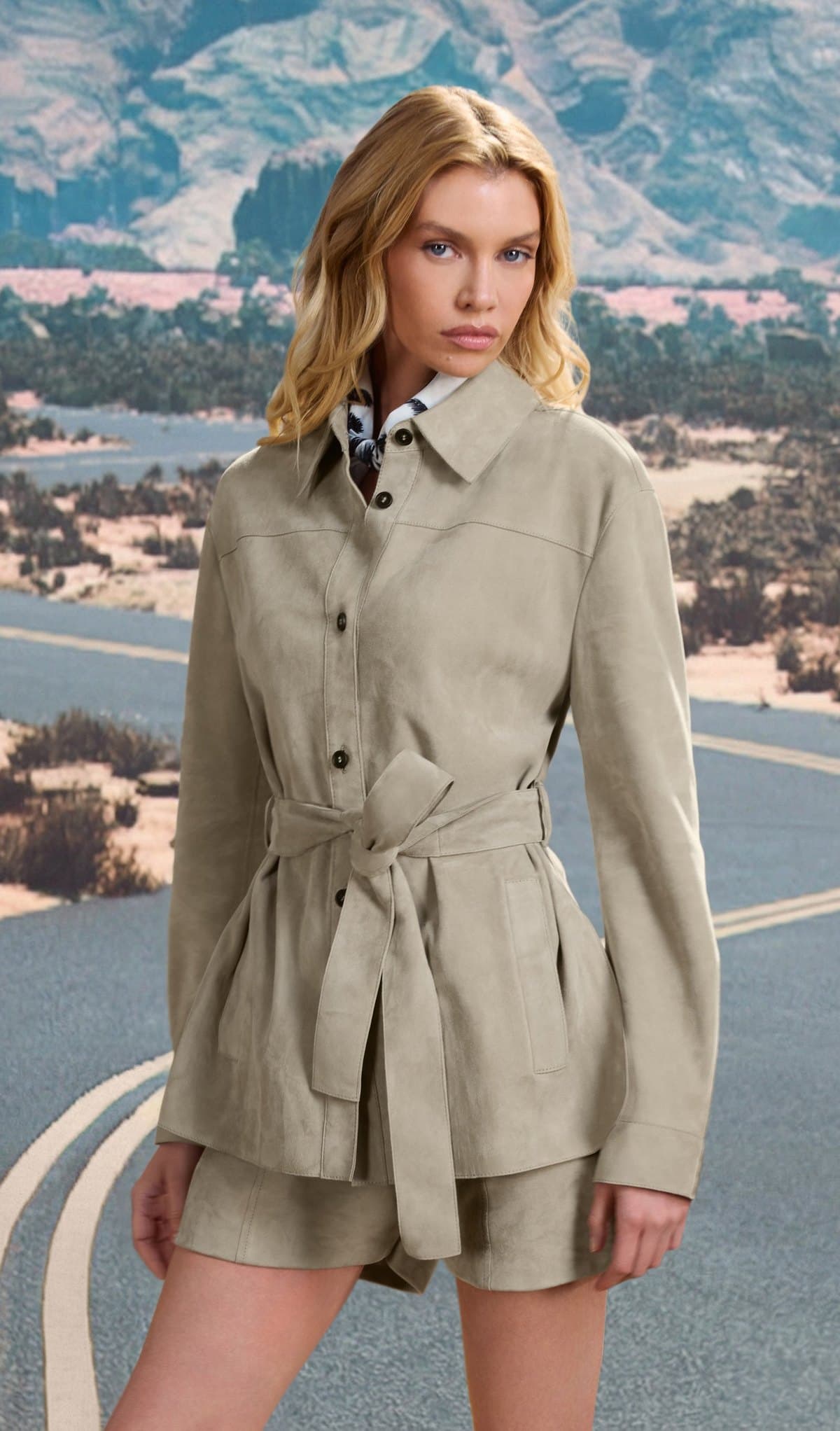 Model in a taupe suede belted jacket