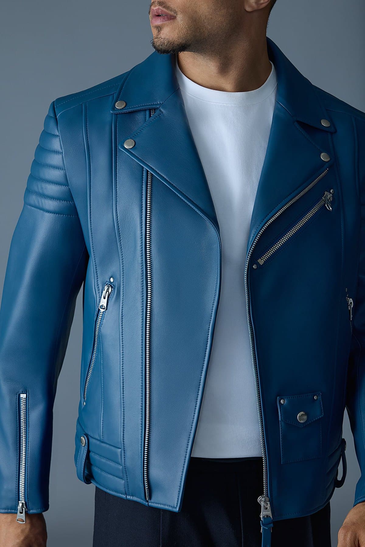 Model in a blue leather biker jacket