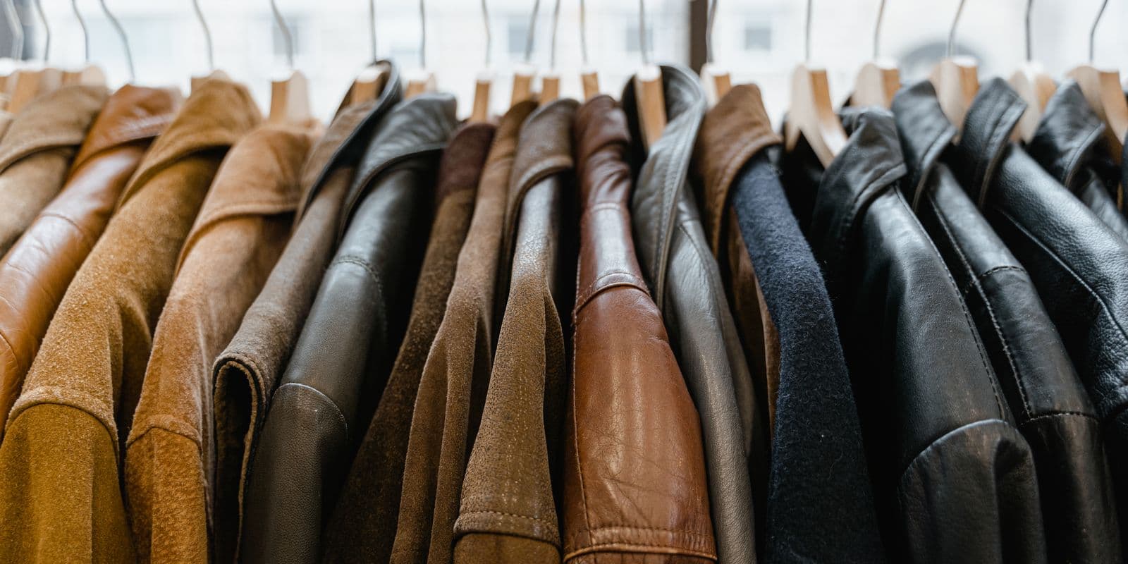 A row of leather jackets in tan, cognac and black
