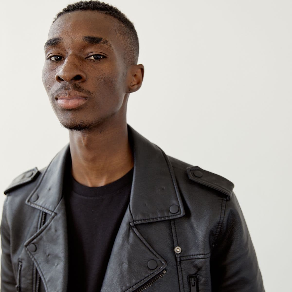 Portrait of a man in a black leather moto jacket