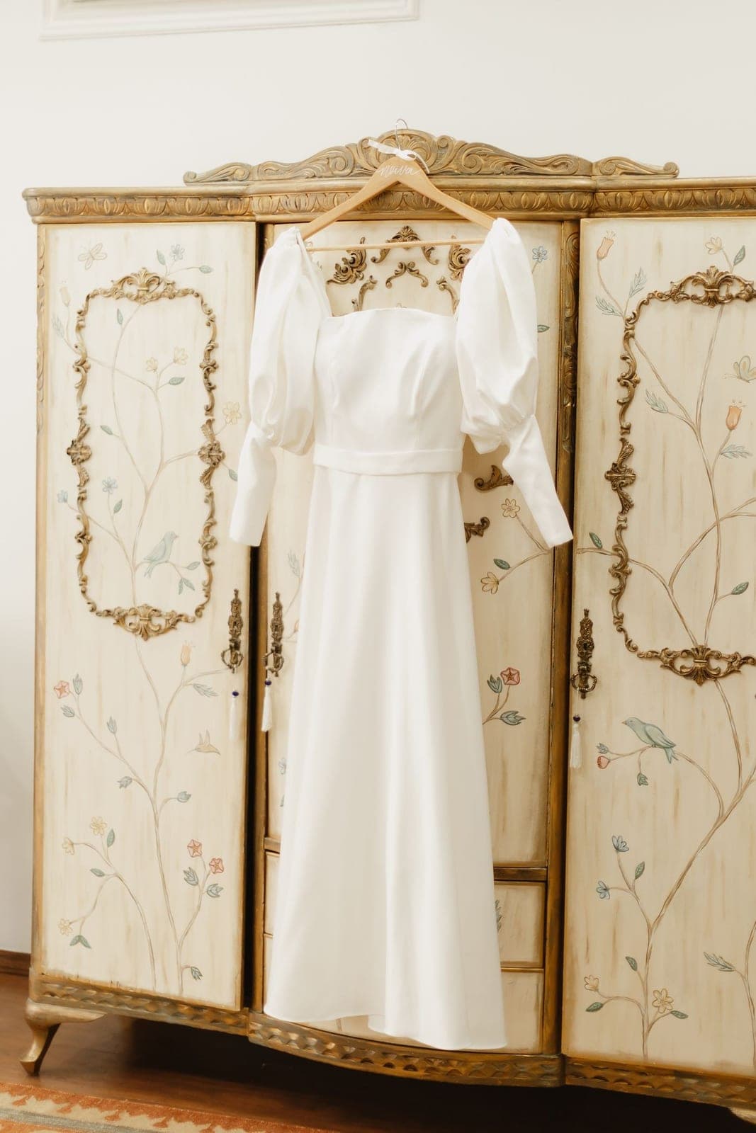 An elegant white dress styled by a vintage screen