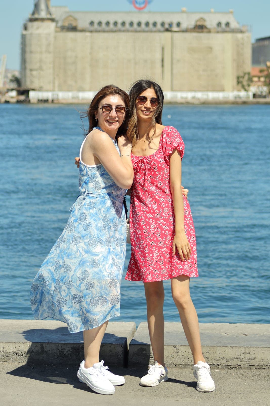 Two women in summer dresses
