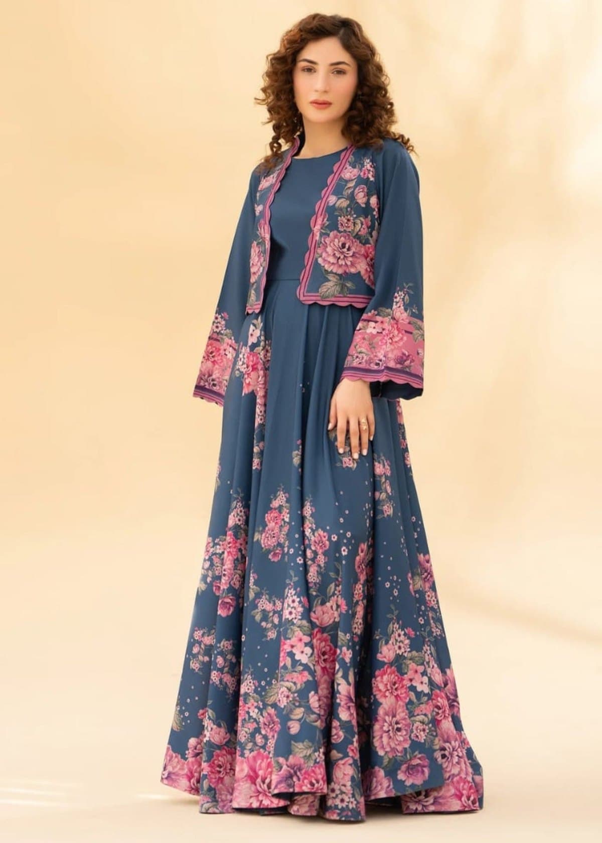 Model in a navy floral jacket maxi dress