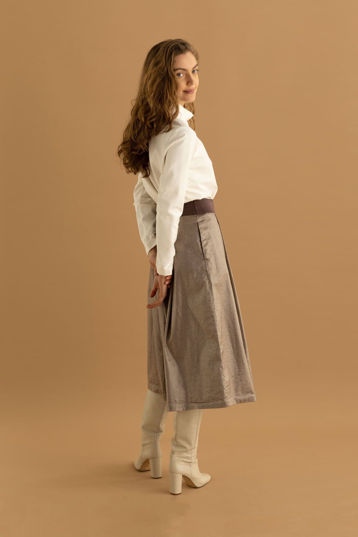 Back view of an ivory A-line midi skirt