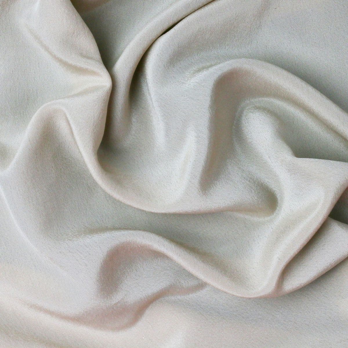 Cream textured dress fabric in soft folds