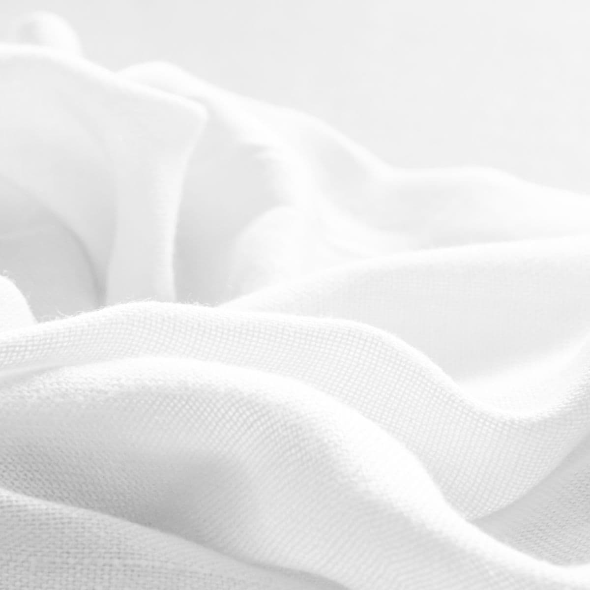 Crisp white cotton shirting fabric in close detail