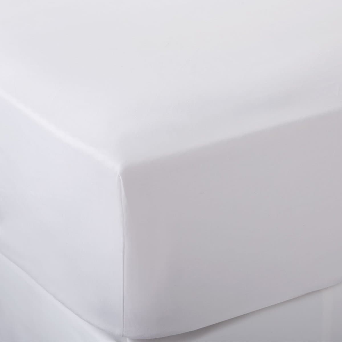 A crisp white fitted sheet on a mattress