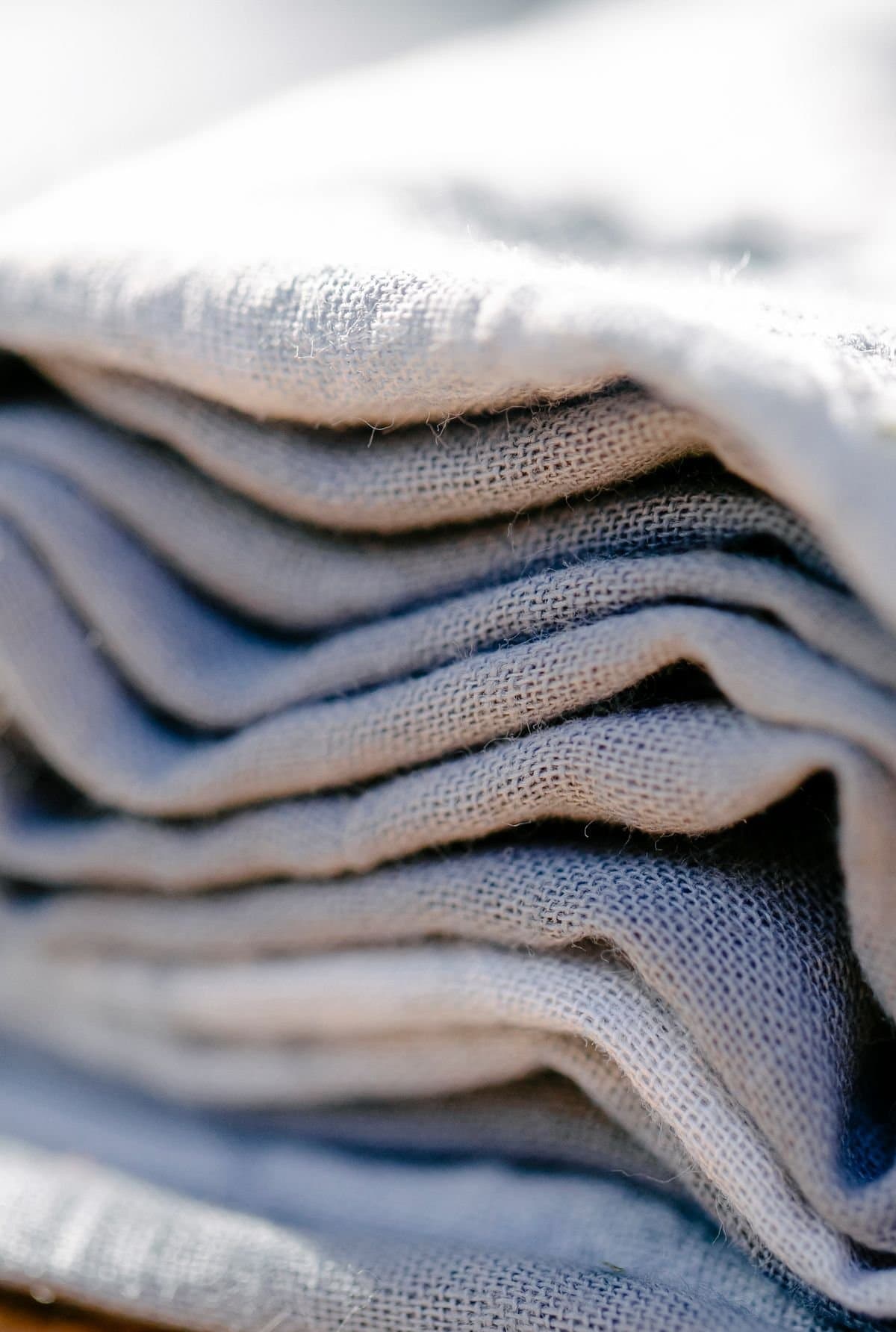 Close detail of folded white cotton linen