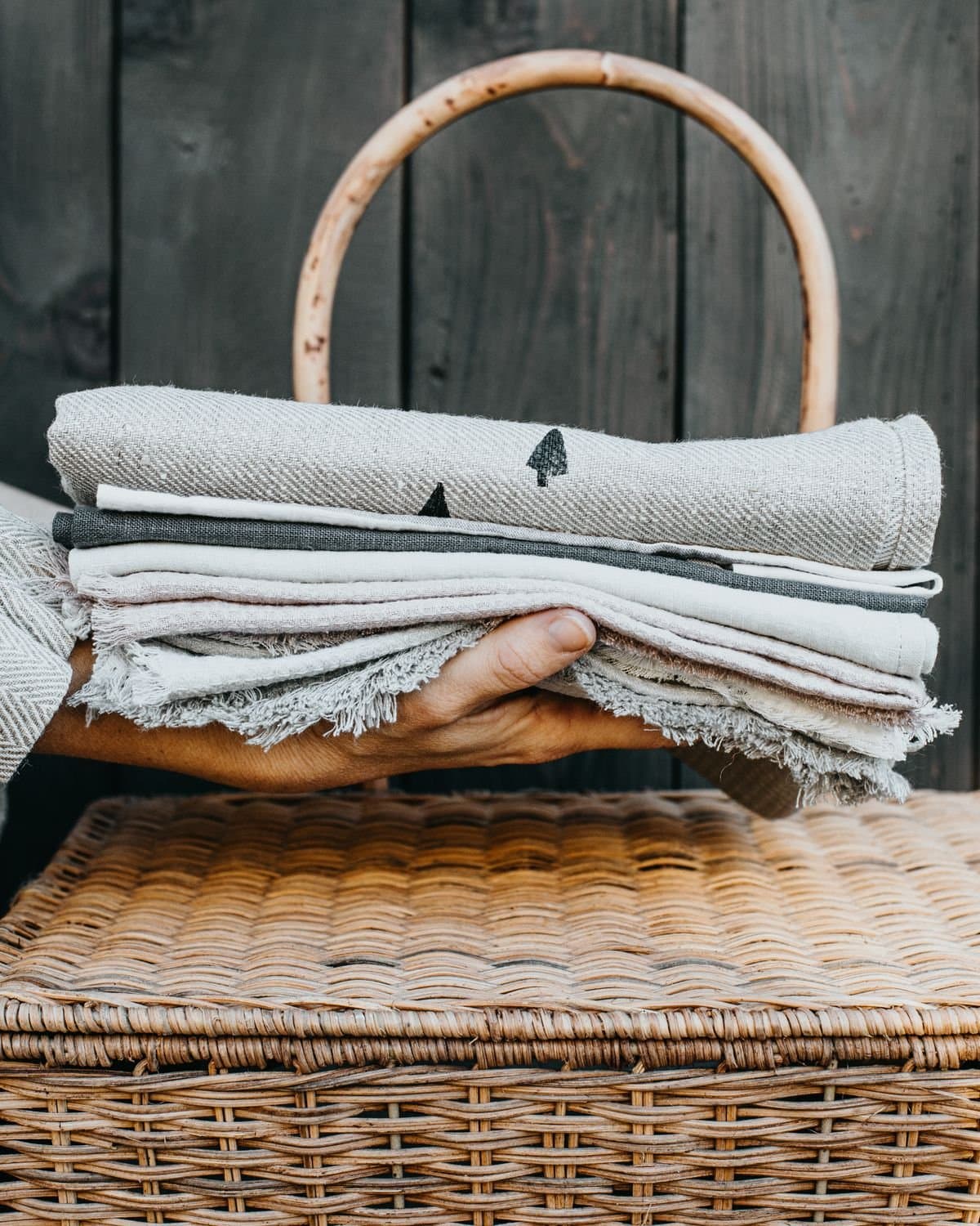 A folded stack of soft white linen