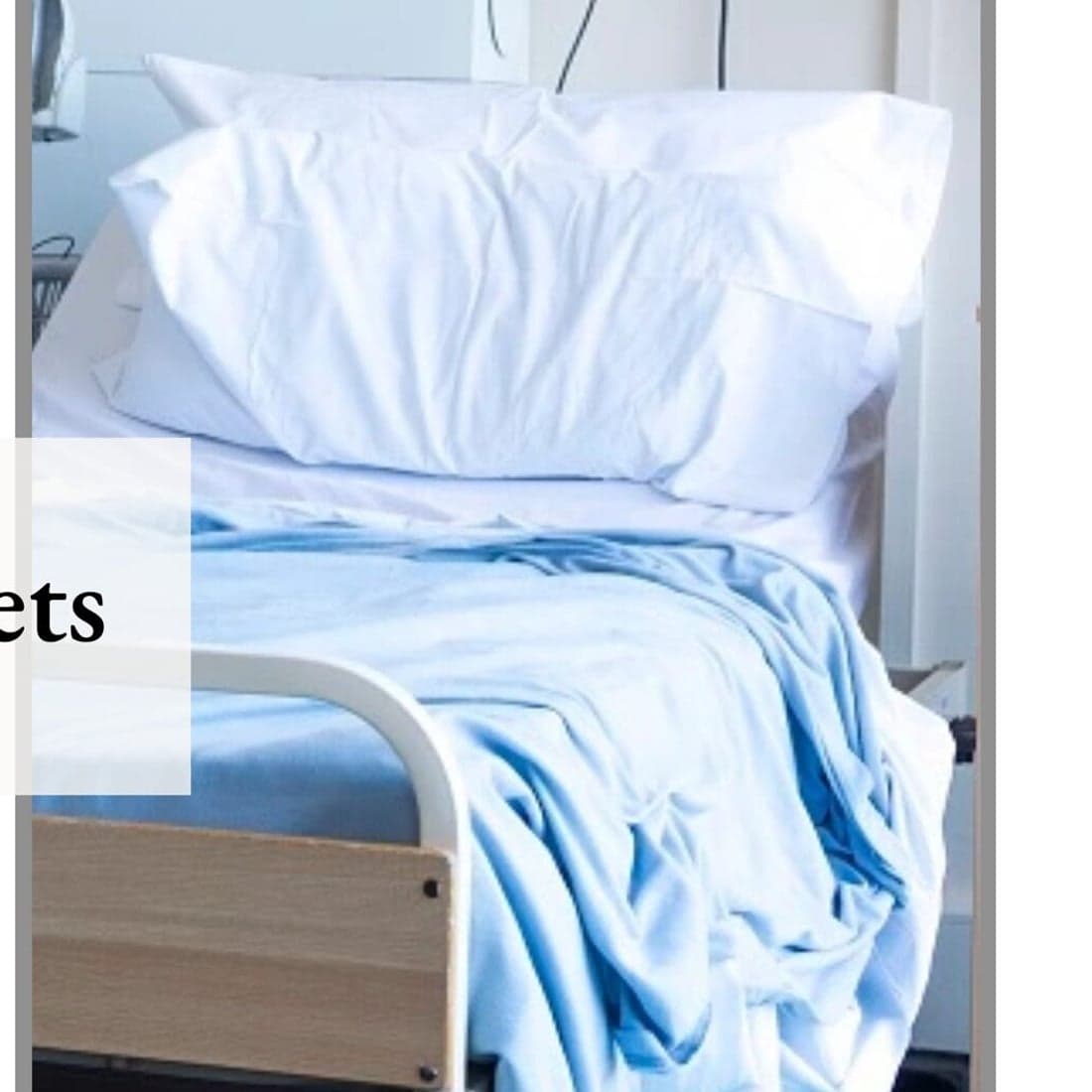 A hospital bed in soft blue linen