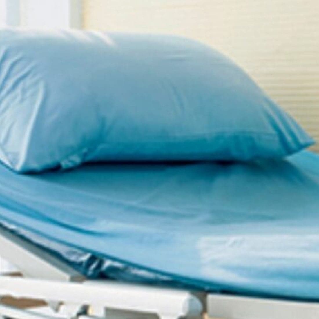A blue pillow on a hospital bed