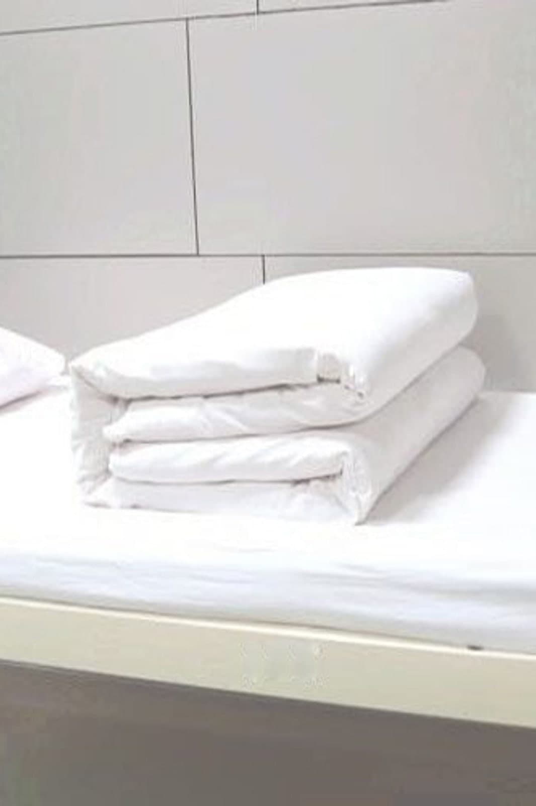 Soft white hospital-grade bed linen in daylight