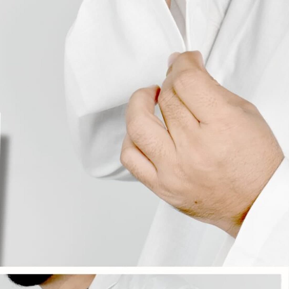 Cuff detail of a white provider coat