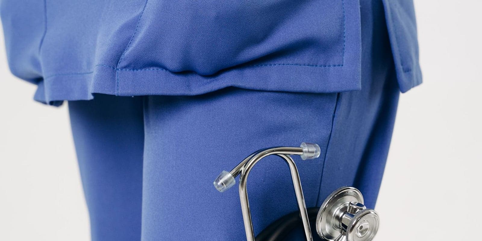 Blue medical scrubs with a stethoscope