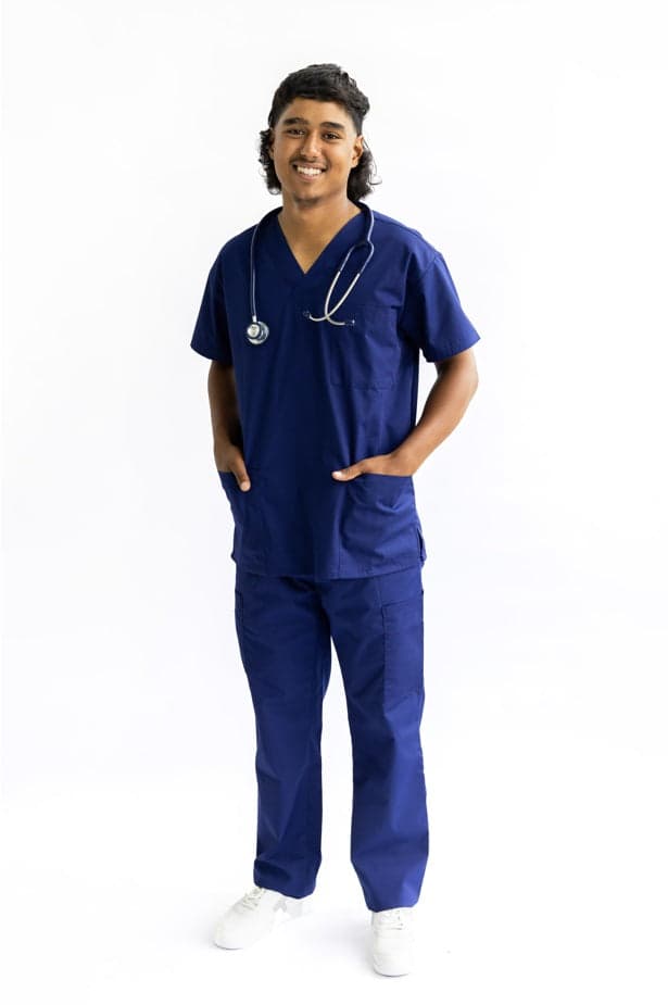 A navy theatre scrub set worn by a clinician