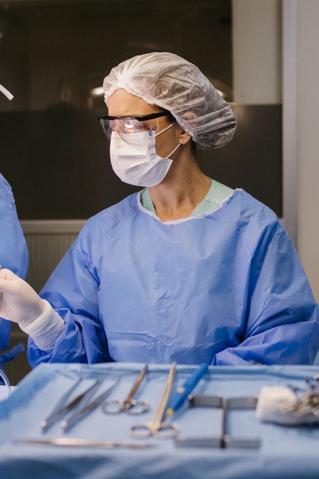 A gowned surgeon prepared in theatre