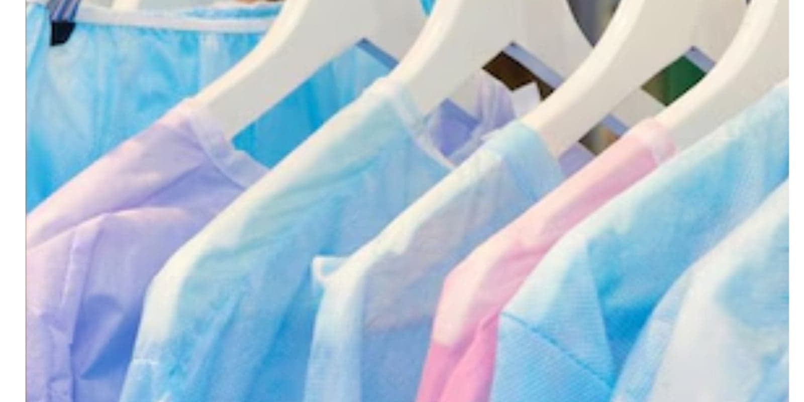 A rack of sterile surgical gowns