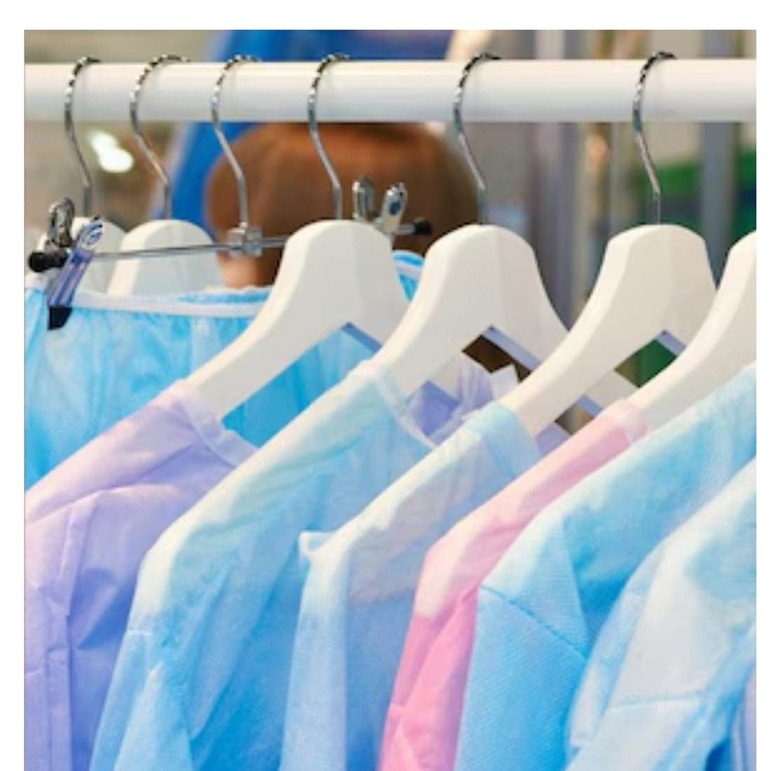 Sterile surgical gowns on a rail