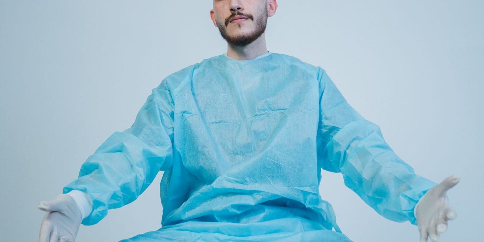 A surgeon in a sterile surgical gown