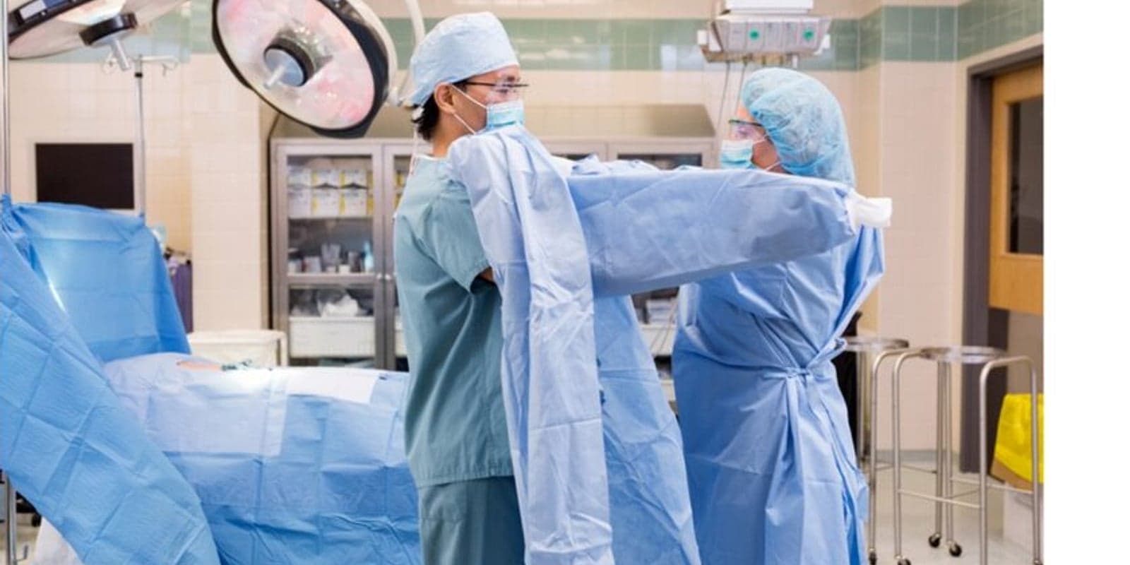 Surgical staff gowning in the operating theatre