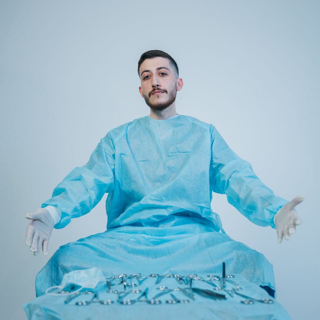 A surgeon in a sterile surgical gown