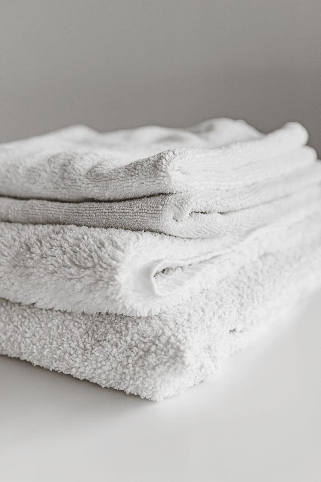 A neat stack of folded white towels