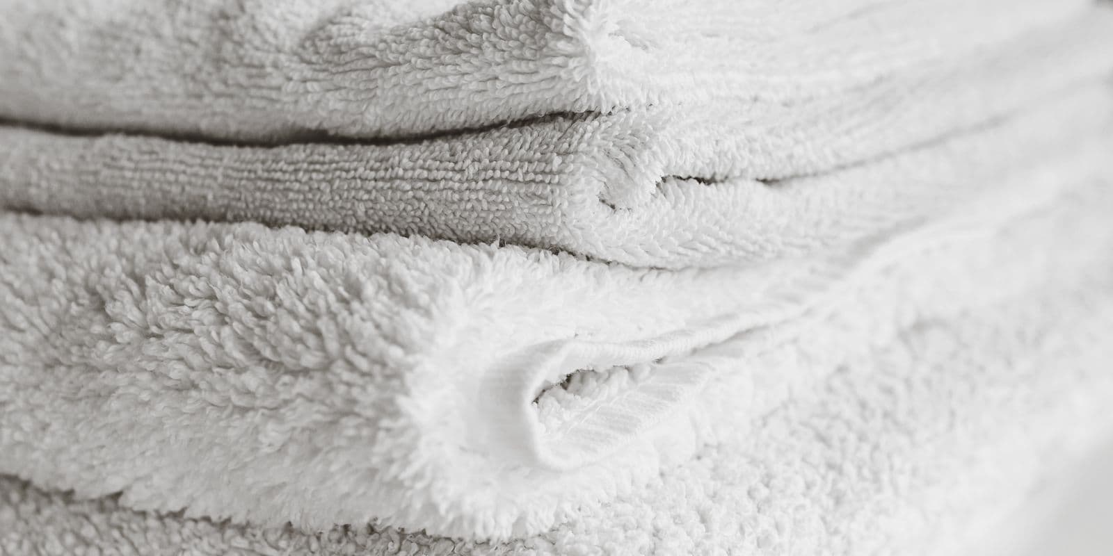 Soft white and grey folded towelling