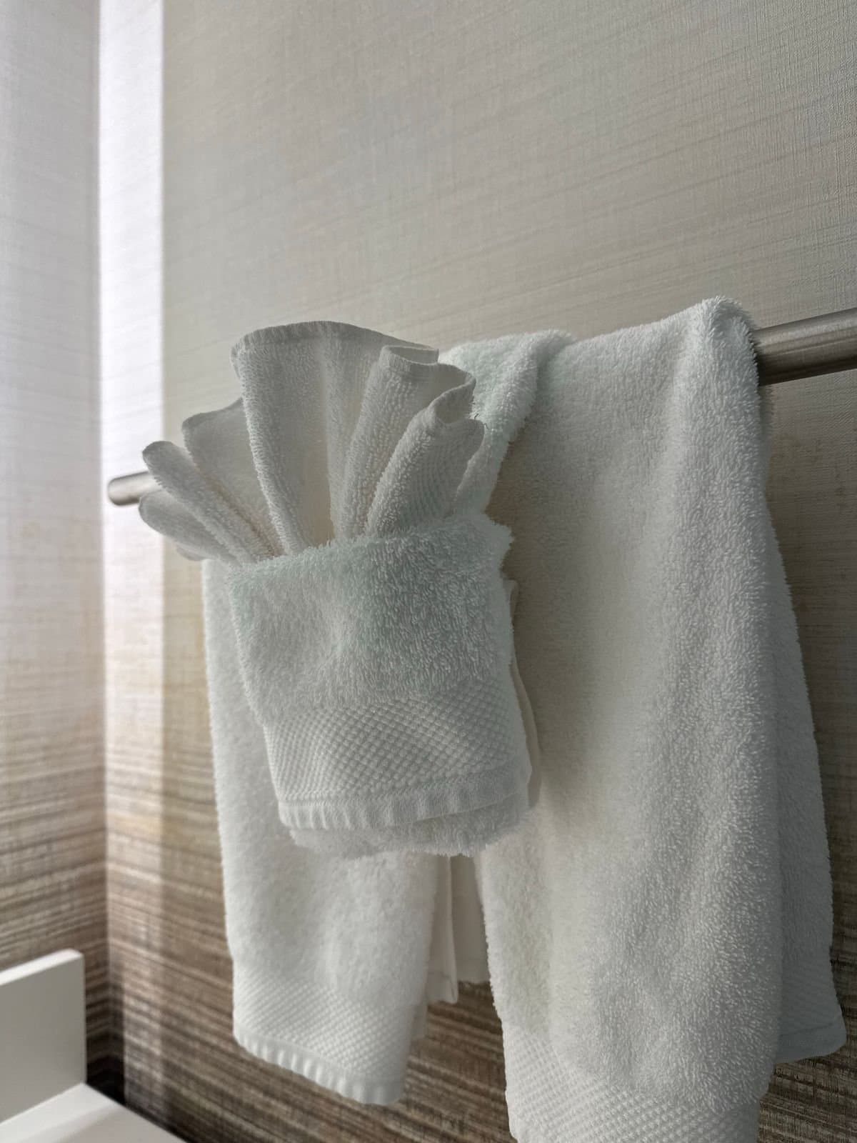 White folded towels on a rail