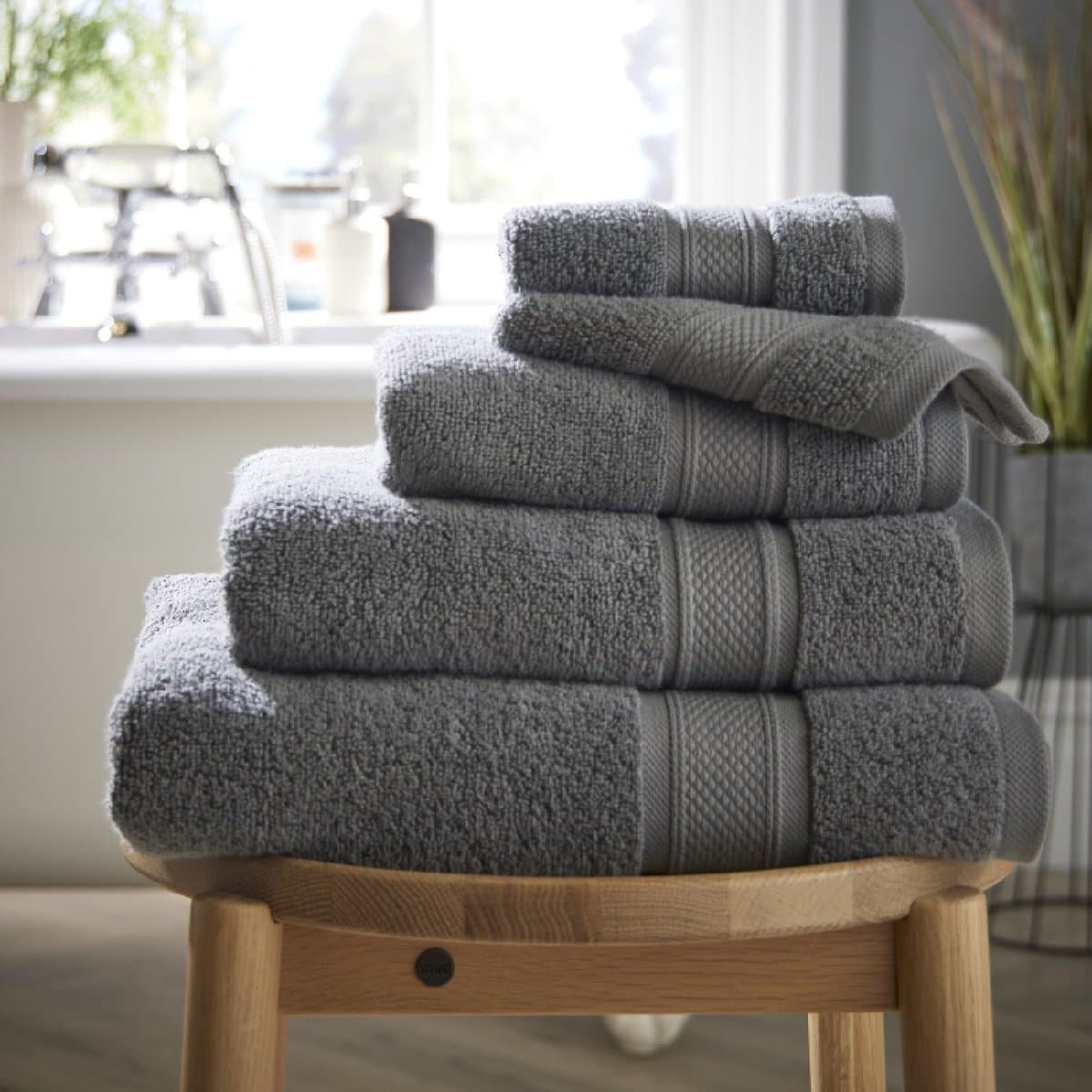 A folded set of grey cotton towels